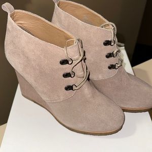 Women’s gently worn wedge boots with laces . Suede